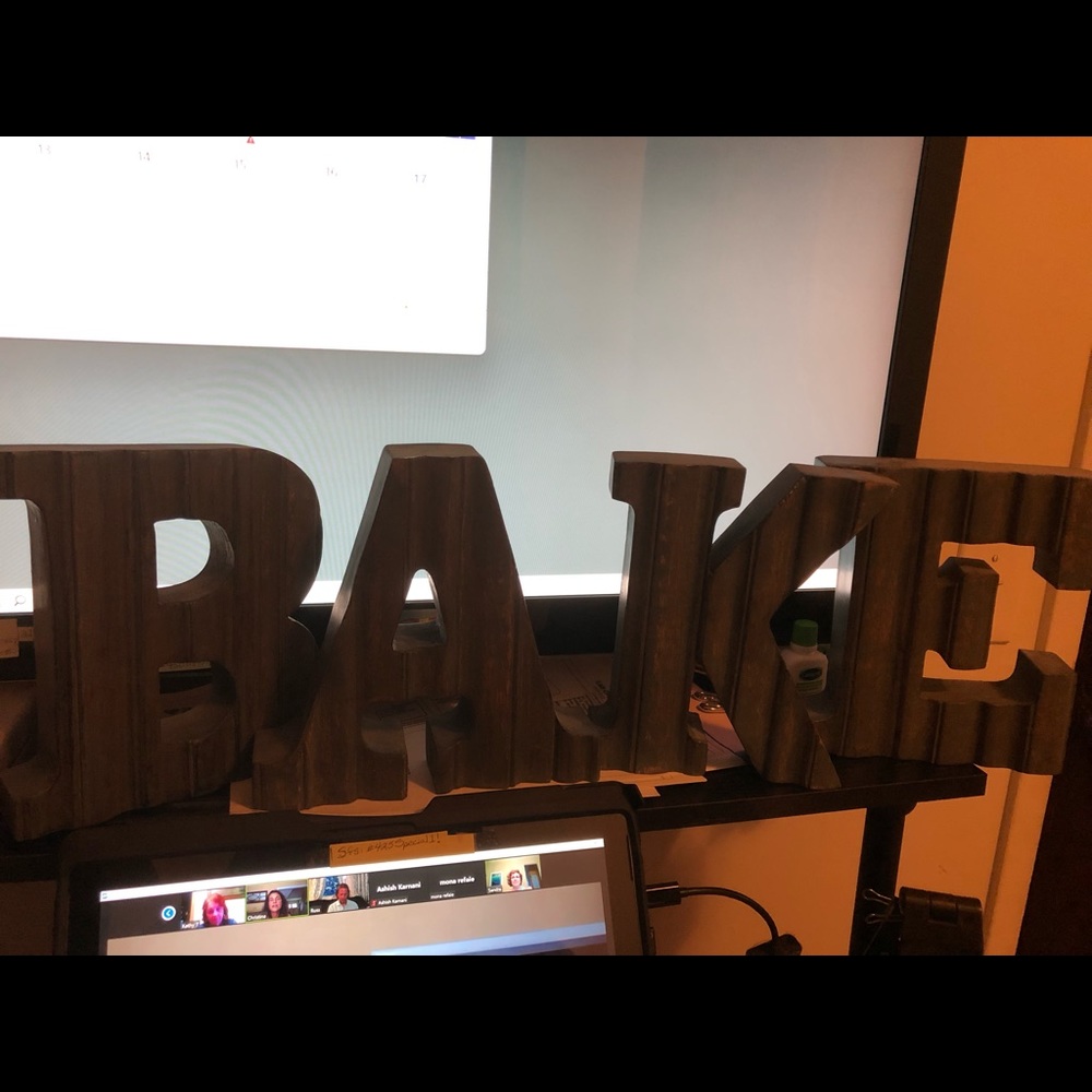 Wood letters spelling BAKE.